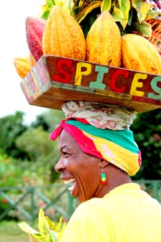 Caribbean woman posing for tourist outdoors.