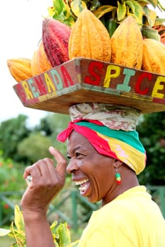 Caribbean woman posing for tourist outdoors.