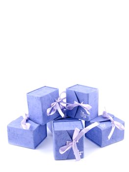 Six small lilac giftboxes on white background