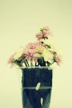 Bouquet of Flowers in a Glass on Vintage background