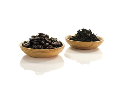 coffee beans and  tea leaves isolated on white
