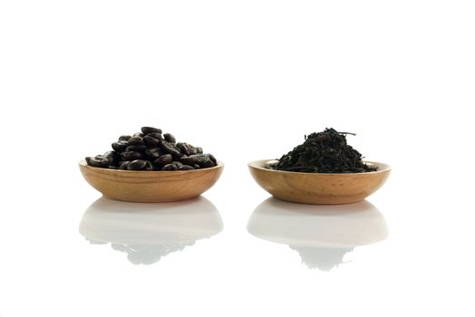 coffee beans and  tea leaves isolated on white
