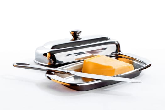 Butter for a pasting on bread lies in special ware with a demountable cover