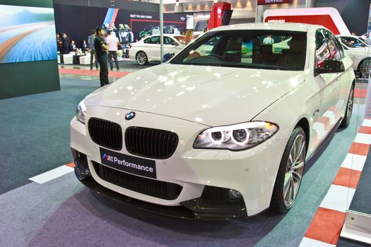 BANGKOK - JUNE 23 : BMW 528i show at The second Bangkok International Auto Salon 2013, the largest and most magnificent Modified Car and automobile accessories show in Bangkok, Thailand.