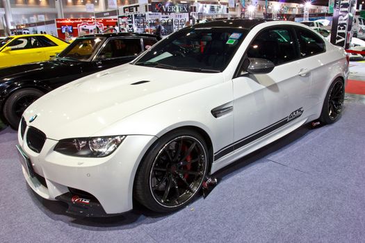 BANGKOK - JUNE 23 : White BMW show at show at The second Bangkok International Auto Salon 2013, the largest and most magnificent Modified Car and automobile accessories show in Bangkok, Thailand.