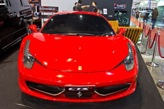 BANGKOK - JUNE 23 : RED FERRARI  show at the second Bangkok International Auto Salon 2013, the largest and most magnificent Modified Car and automobile accessories show in Bangkok, Thailand.