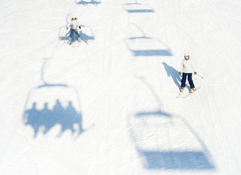 Bukovel, Ukraine - December 13, 2013: Skiers on a slope in Bukovel, Ukraine. Bukovel - is the largest ski resort in Ukraine. In 2012 it was named the most fast growing world ski resort.