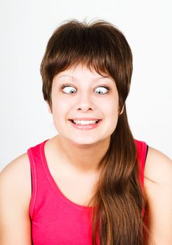 cross eyed squinting expression young girl. portrait