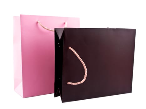 Brown and pink gift bags on white background
