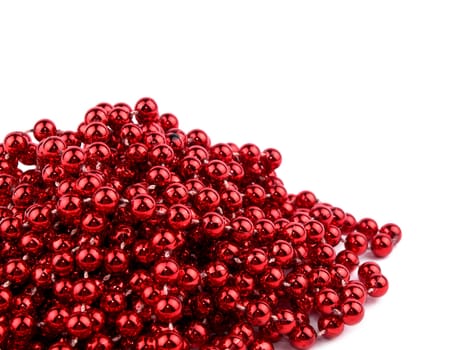 Christmas garland made from small red beads, on white background.