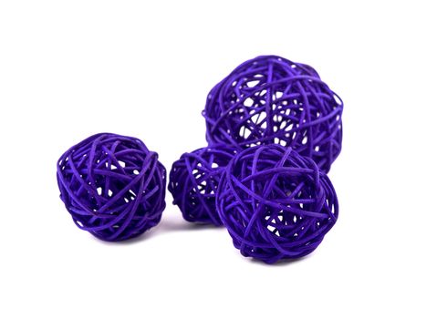 Picture of purple rattan balls on white background