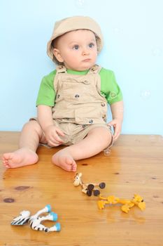 Cute caucasian baby boy wearing a hat