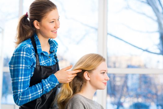 young attractive woman hairdresser hairstyle customer picks