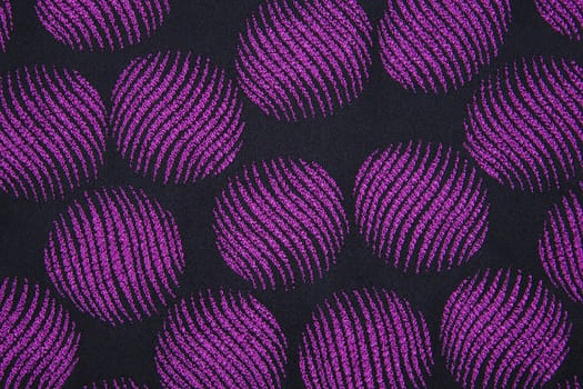 Material in geometric patterns, a colored textile background.