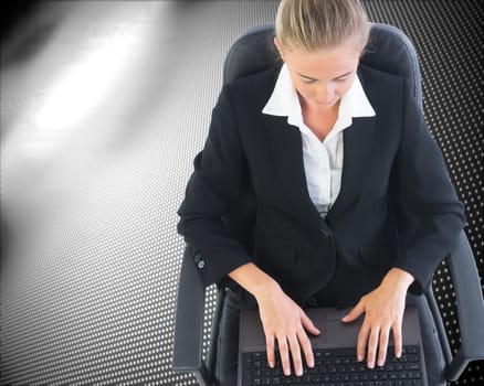 Composite image of blonde businesswoman sitting on swivel chair with laptop on black and white dotted background