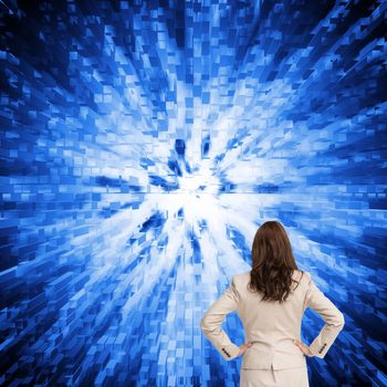 Composite image of businesswoman standing back to camera watching futuristic black and blue background