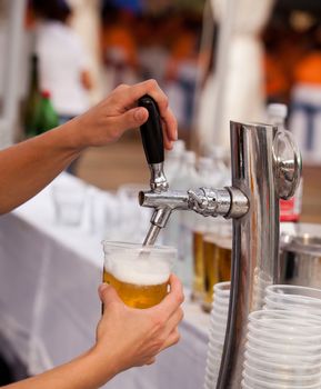 A beer being poured from a beer tap