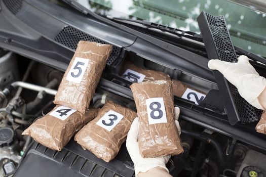 Hidden drugs in a vehicle compartment