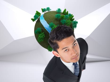 Composite image of serious asian businessman 