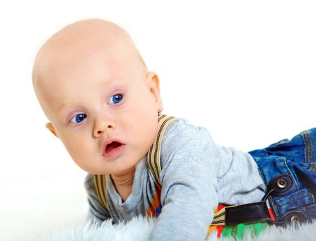 Closeup portrait of cute baby boy on white background.