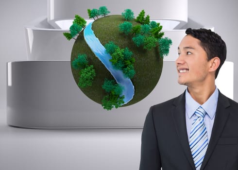 Composite image of smiling asian businessman 