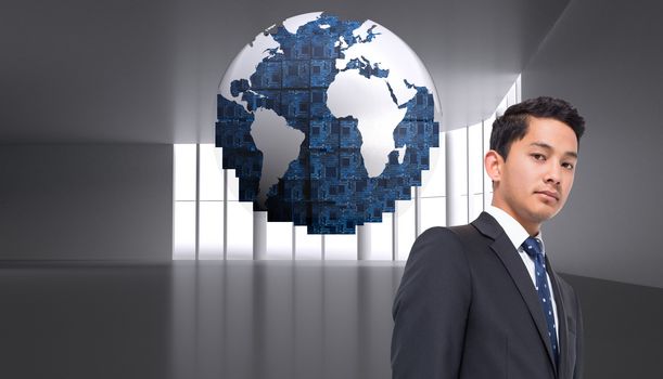 Composite image of  businessman against digital globe on grey abstract background