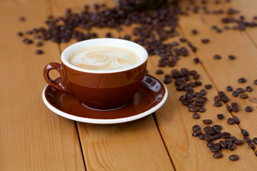 cup of coffee on wooden table