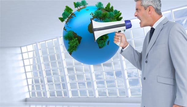 Composite image of businessman shouting in loudspeaker