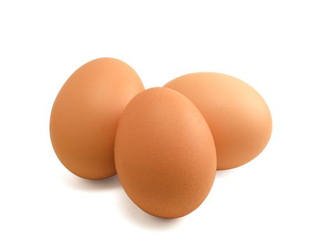 Three brown eggs isolated on white with clipping path