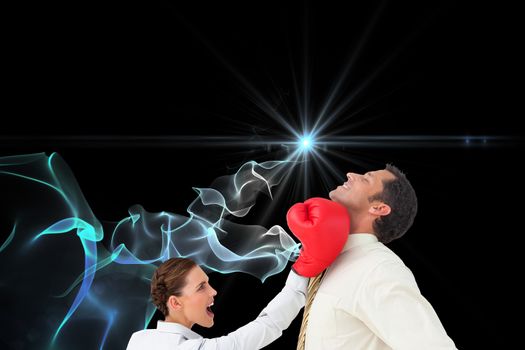 Composite image of businesswoman hitting a businessman with boxing gloves