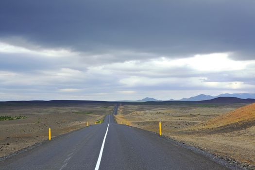 Highway through Iceland landscape at foggy day. Horizontal shot