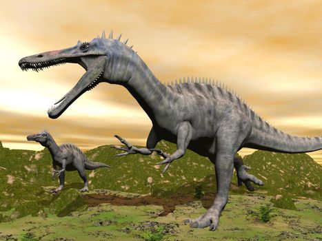 Two suchomimus dinosaurs in nature with green grass by colorful sunset
