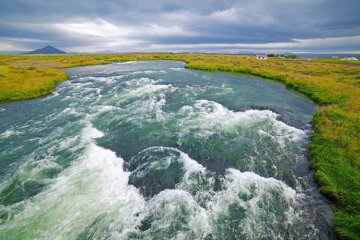 Summer Iceland landscape with big mountain river.