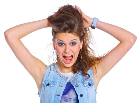Teenagre girl grimacing. Face portrait against white background