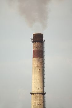 Smoking chimney of an industrial plant