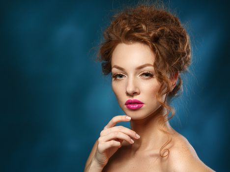 Beauty Fashion Model Girl with Curly Red Hair, Long Eyelashes. Beautiful Stylish Woman with Healthy Smooth Skin. Perfect Makeup.