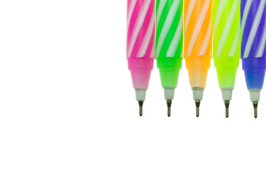 Five color pen on white background with soft light. The spiral pattern on 5 color pen.