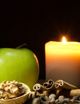 Green apple, cinnamon, walnut and a candle