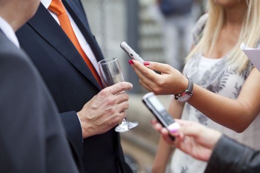 A journalist is making a interview with a microphone