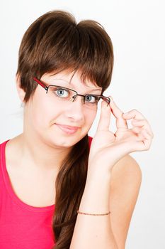 Young attractive blue-eyed girl in glasses. portrait