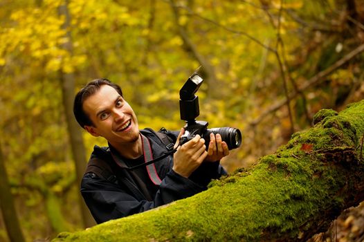 Happy photographer in a forest