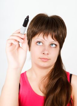 Young attractive girl writing with a black marker