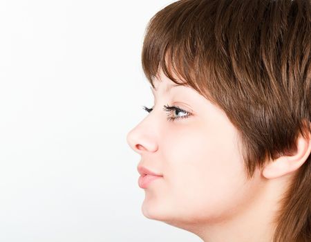 Young attractive girl kisses the. Portrait in profile