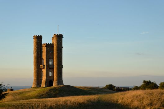 Sunset at the Broadway Tower on a hill in the Cotswolds in England, UK.