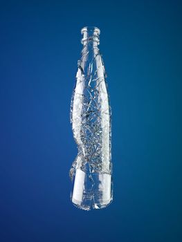 Broken empty glass bottle on blue background