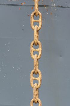 huge rusty anchor chain links on a vessel
