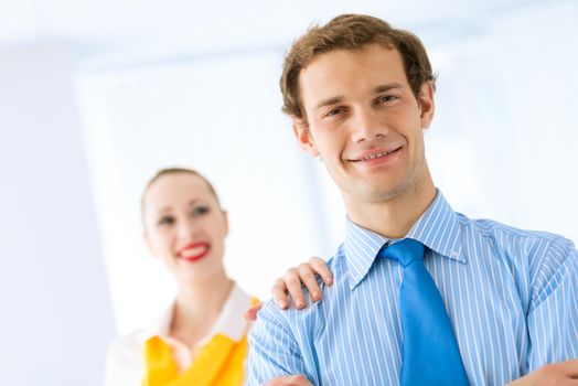 Businessman receiving congratulations from his colleagues in the leadership team work