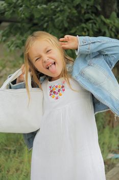 Portrait of girl with smile and makes faces