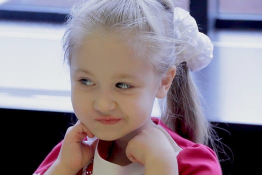 Portrait of beautiful girl with blue eyes
