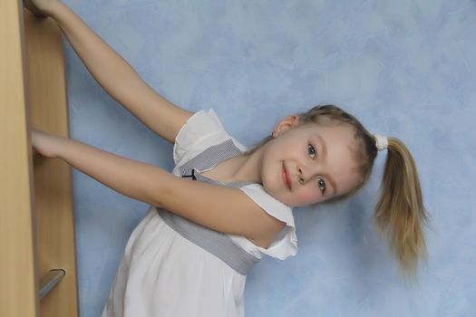 Image of callisthentics girl in white dress